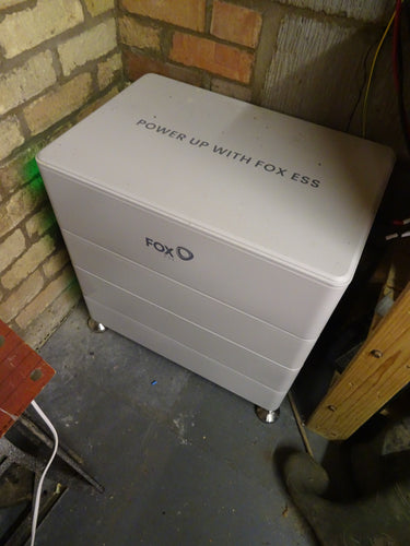 Fox ESS Cube batteries with 'Power Up with Fox ESS' text.